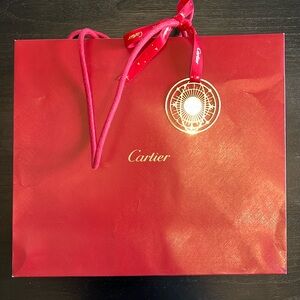 Cartier shopping bag with gold tassel.